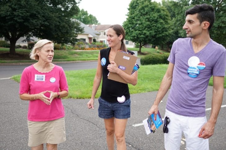 Candidate Maria Collet (left) canvassing with Sister District DC volunteers