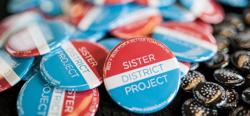 Sister District buttons
