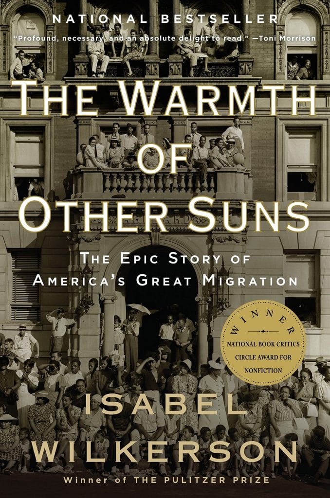 book cover of The Warmth of Other Suns by Isabel Wilkerson with white font over photo of historic urban area