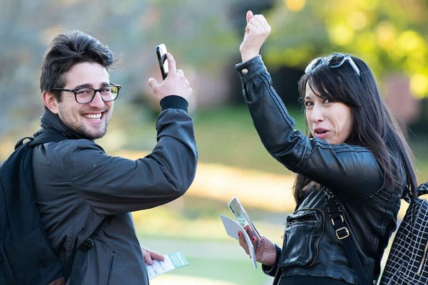 Two Sister District Volunteers cheer as they are canvassing